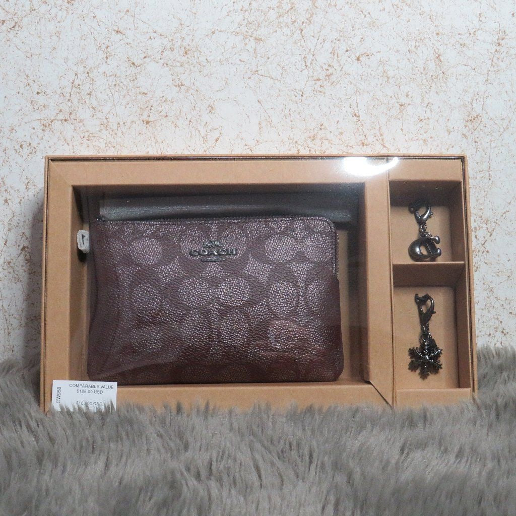 Boxed Corner Zip Wristlet in Signature Canvas with charms